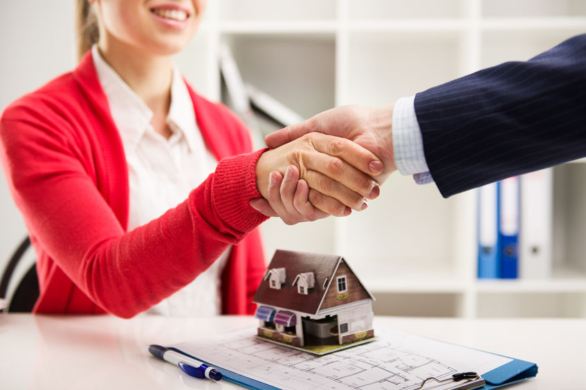 two business people shaking hands as successful agreement