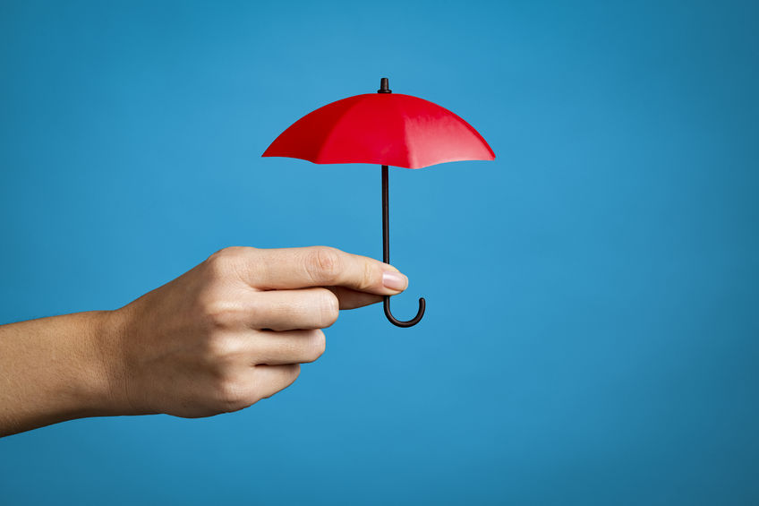 hand holding up red umbrella