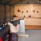 Woman shoots a gun at a shooting range.