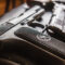 Detail shot of weathered generic russian soviet semi-automatic 9mm pistol on black background